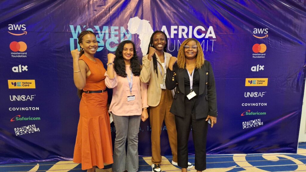 Nimie in the orange and a few other women at the Women In Tech event 2025