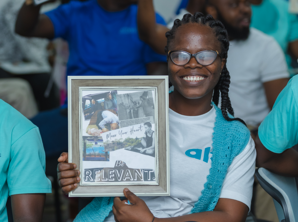 Vivian Dzrekey holding up a framed collage | Overnight Success is an Illusion - #FindYourPlace